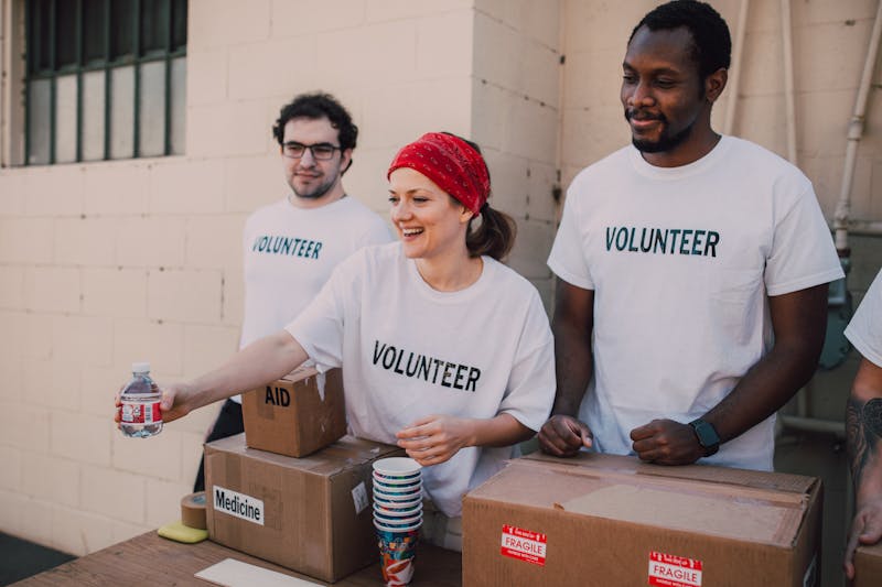 Volunteers distributing emergency supplies to disaster relief recipients